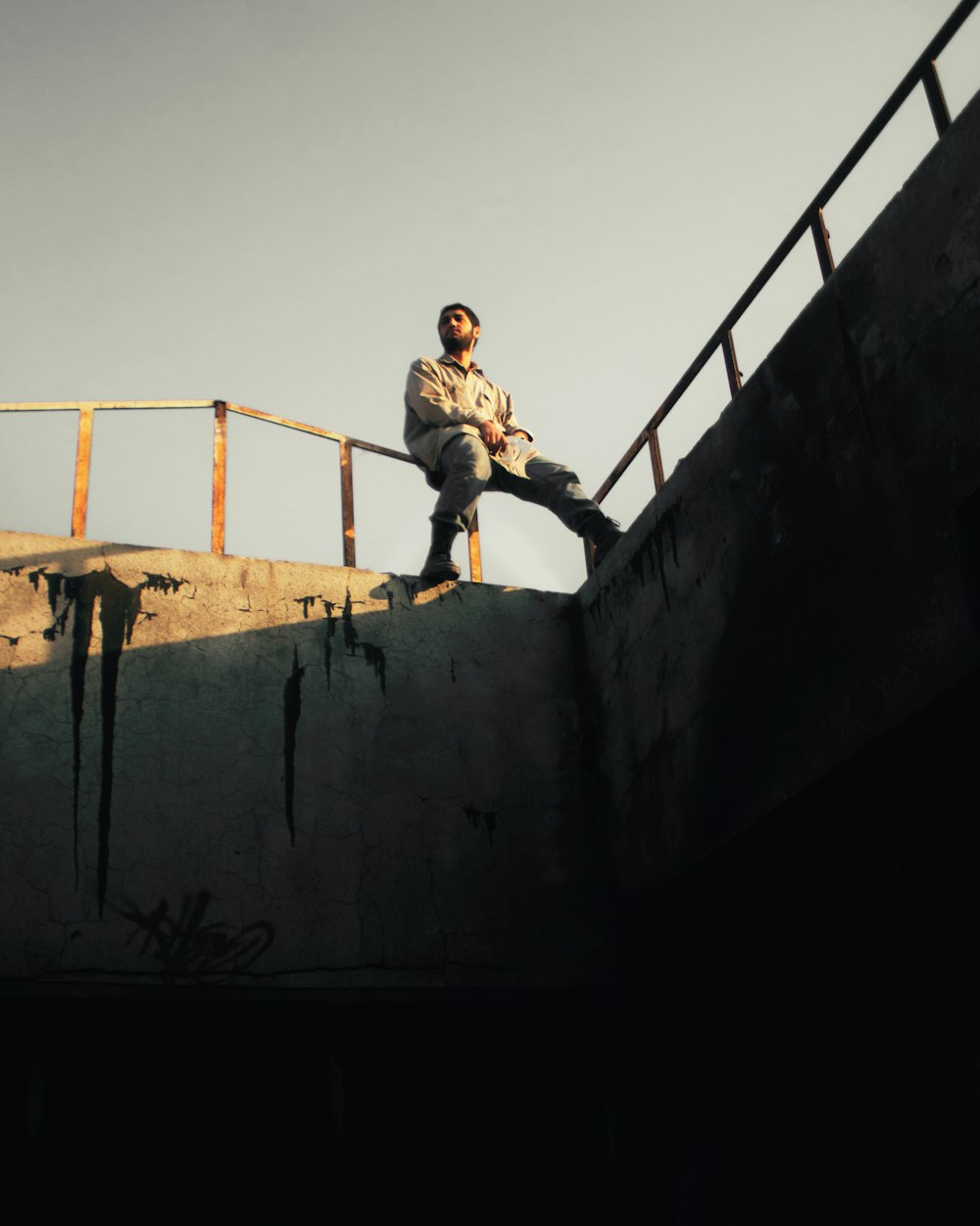 man sitting on the fence