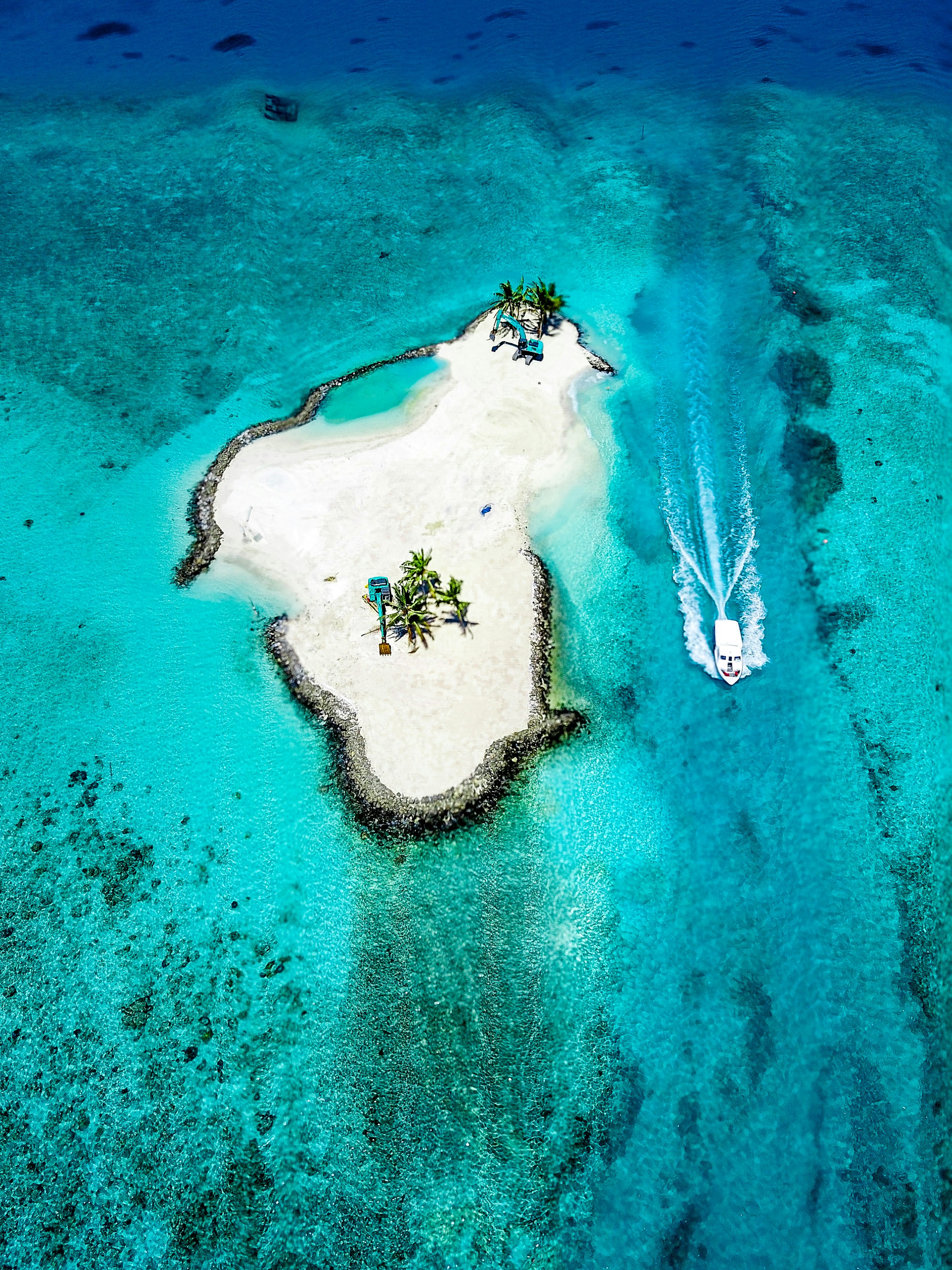 A turquoise Mauritian lagoon meeting a mountainous coastline