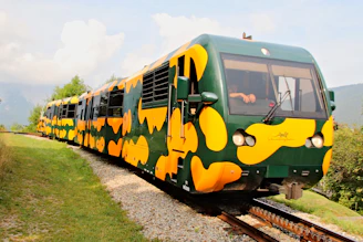 An elegant train weaving through lush mountain landscapes in Asia