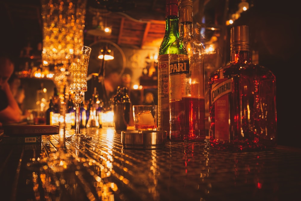 assorted flavor of wine bottles on table