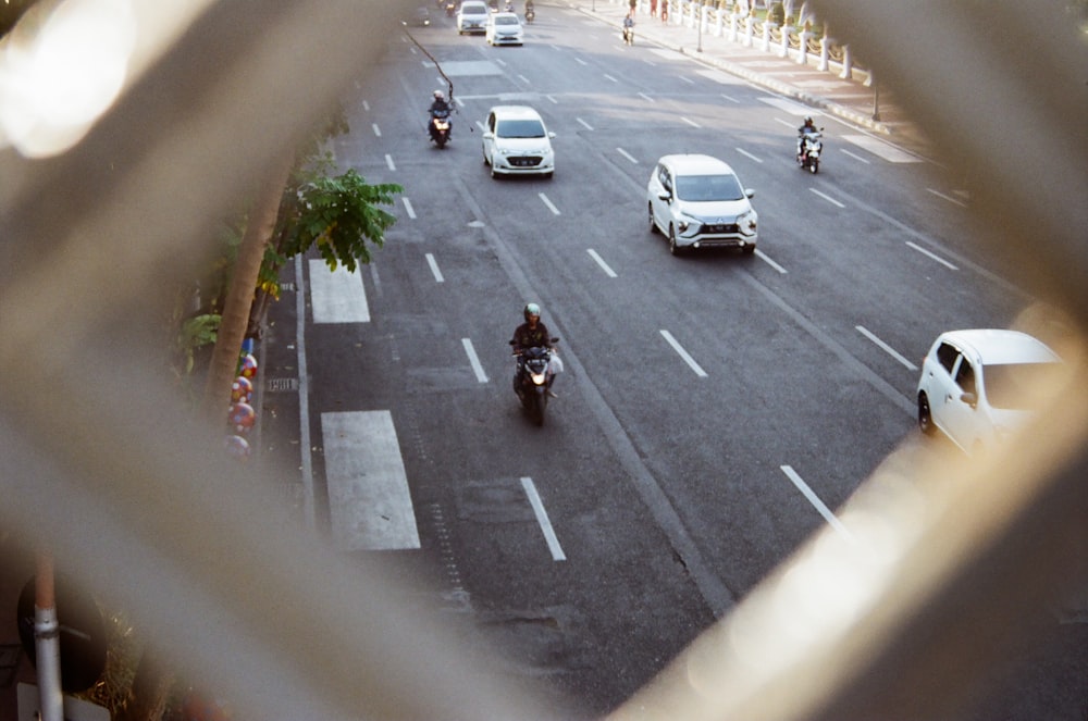 man riding motorcycle on roadway