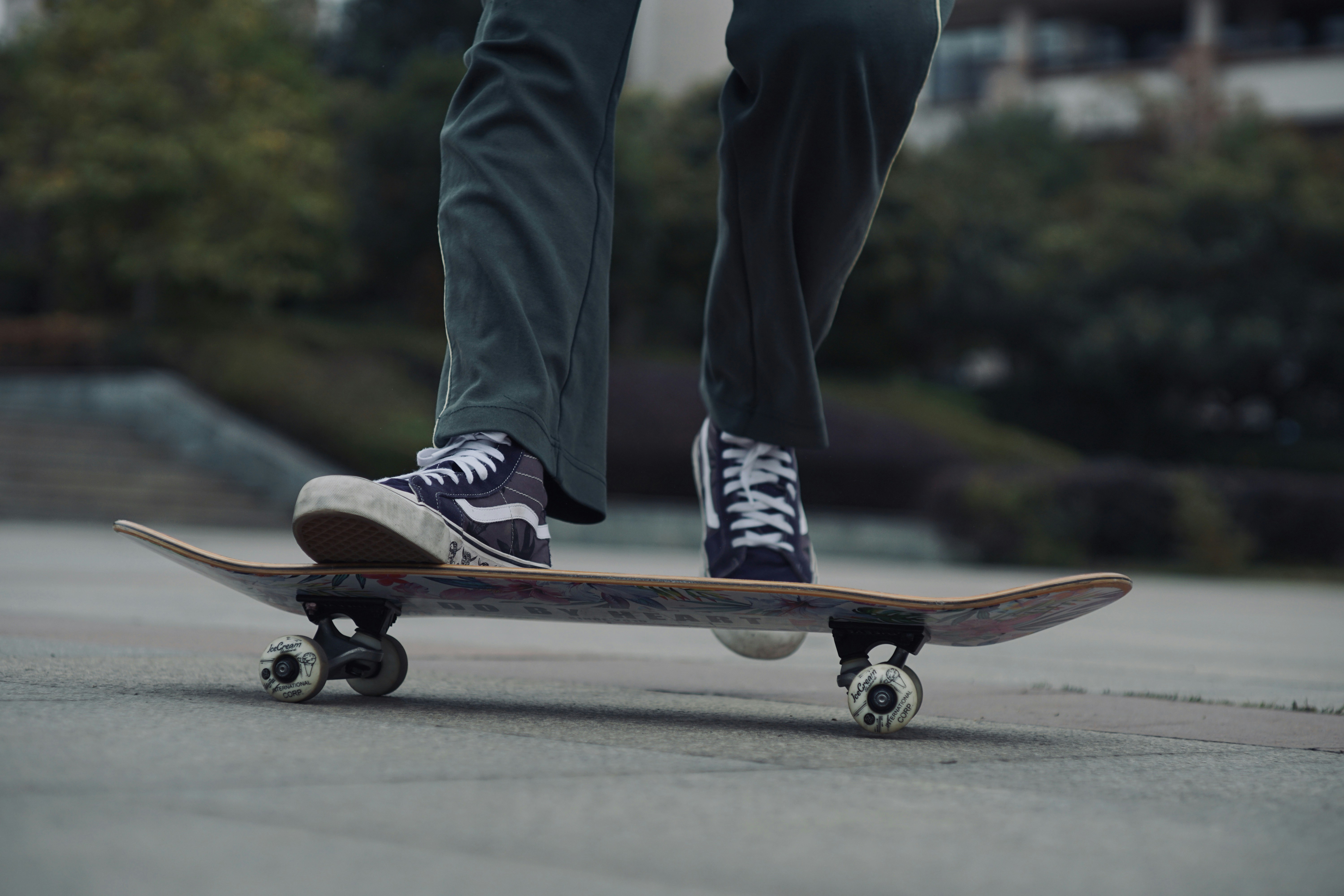 man skateboarding on gray ground