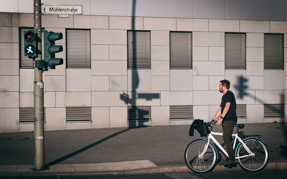 man riding on commuter bike