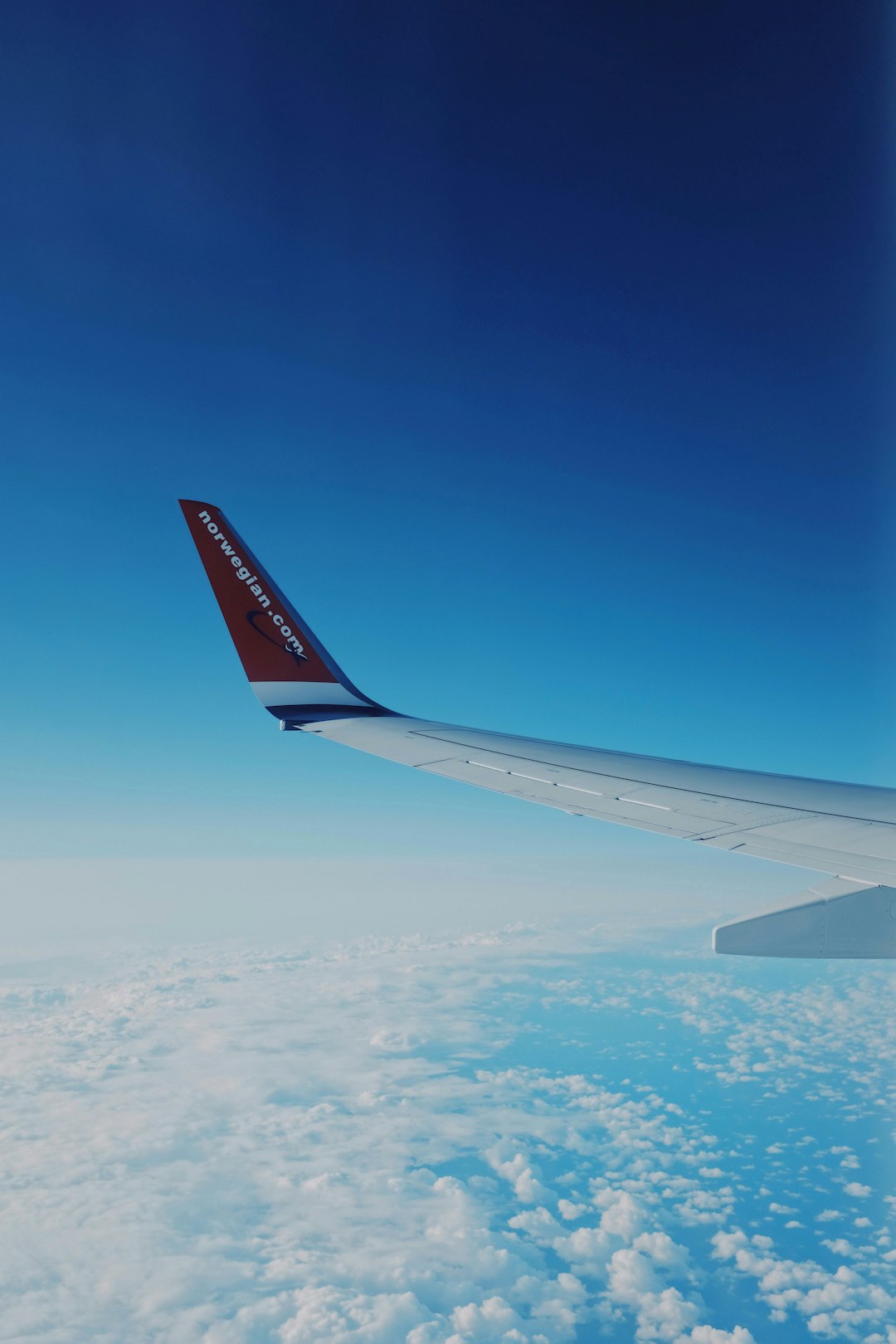 white and red airplane wings