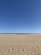 body of water and white sand
