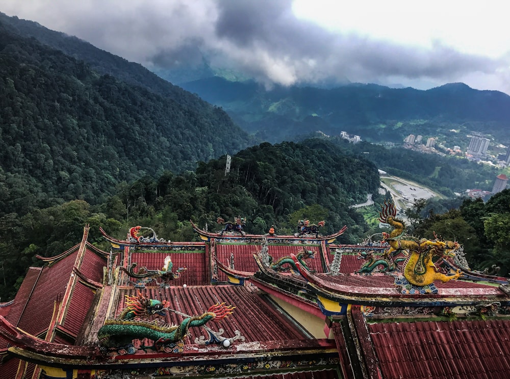 red roof houses surrounded by mountains