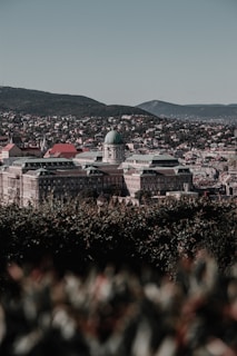A panoramic view of a restored architectural masterpiece against a scenic backdrop.