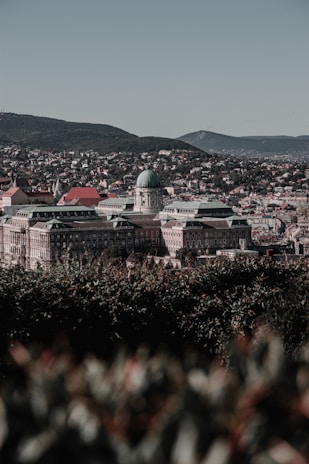 A panoramic view of a restored architectural masterpiece against a scenic backdrop.