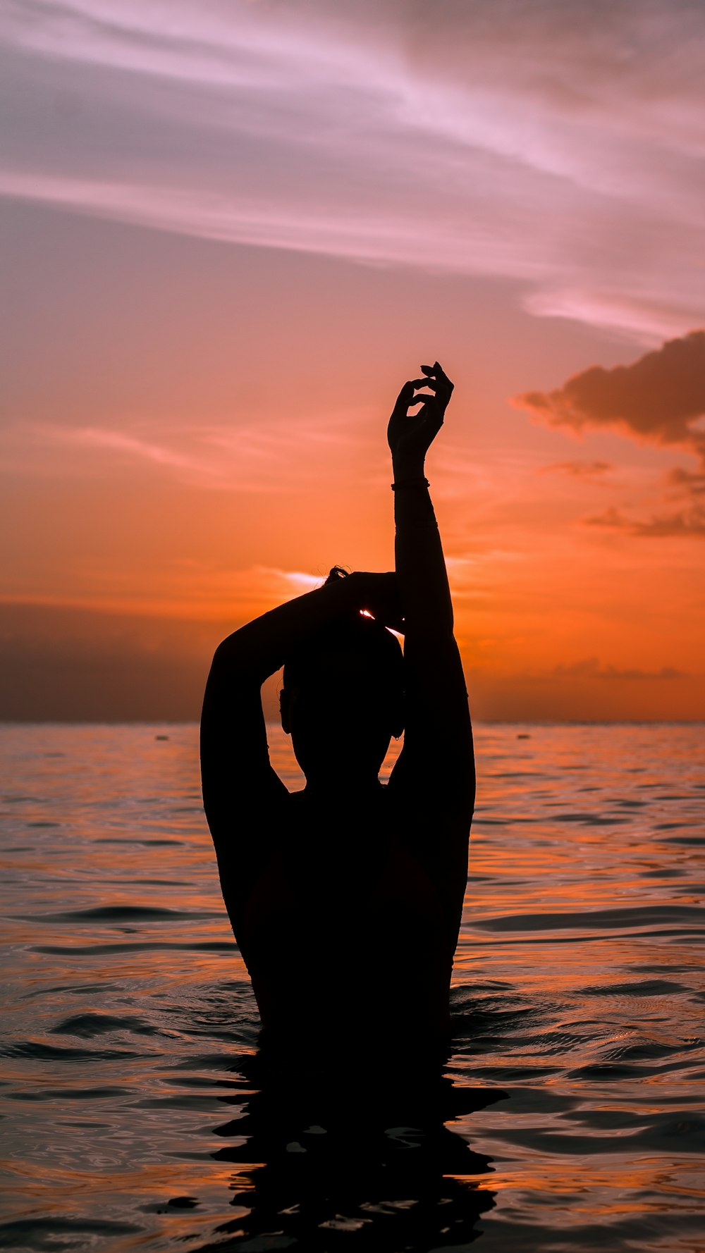 silhouette photo of person in body of water