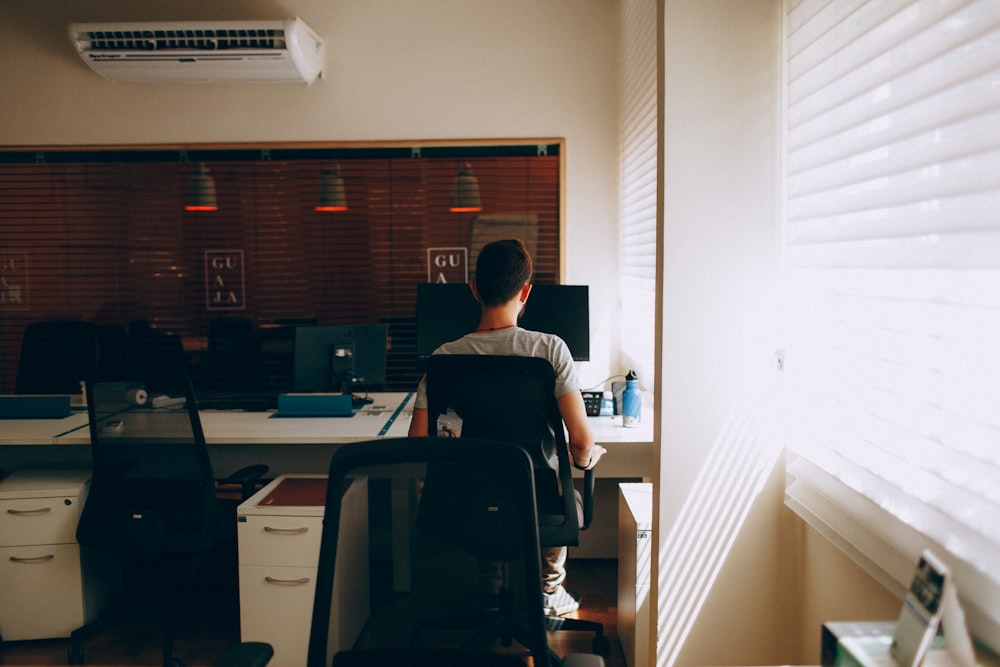 man sitting at his desl