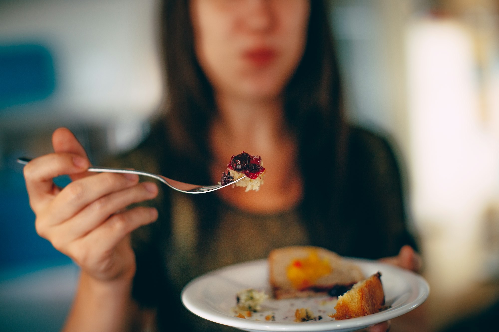 woman eating cake