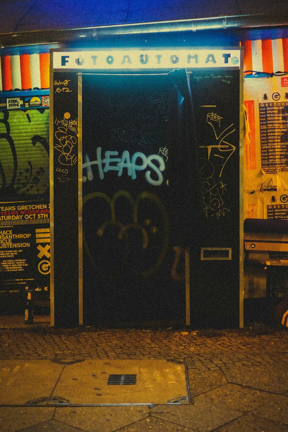 a door with graffiti on it in front of a building