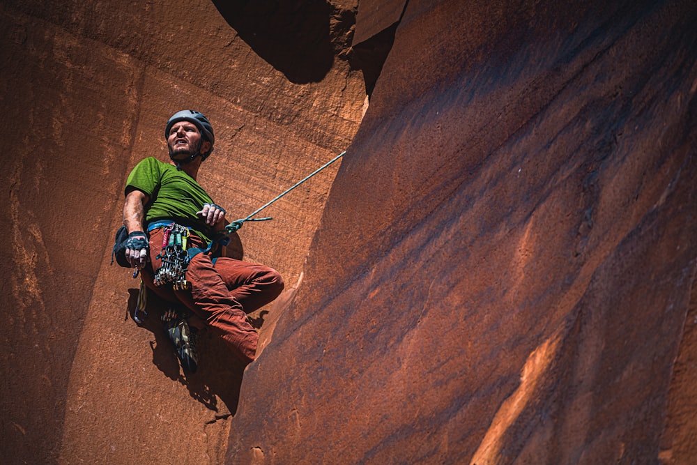 man climbing mountain