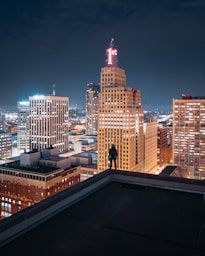 person standing on the edge of the building