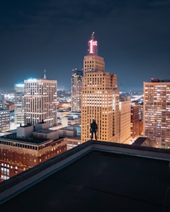 person standing on the edge of the building