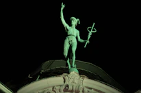 Close-up of a caduceus staff logo featuring elegant snakes intertwined, representing health and trust.