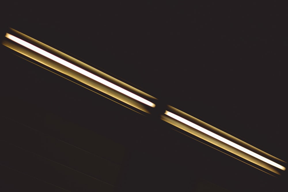 a close up of two lights in the dark