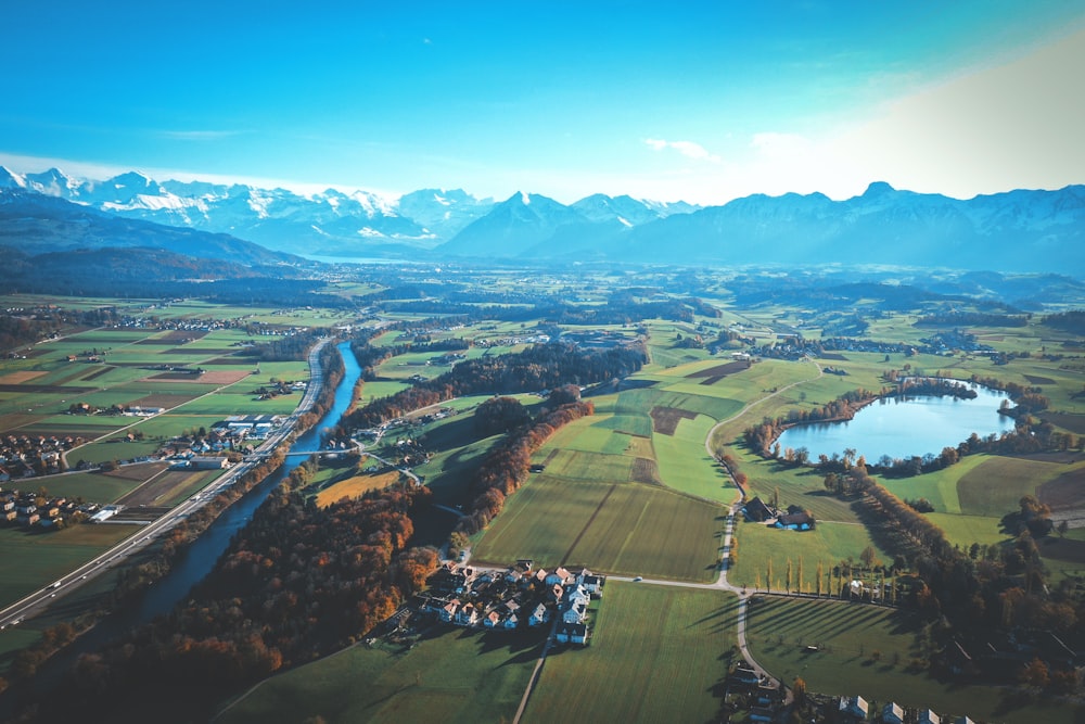 green field near mountains