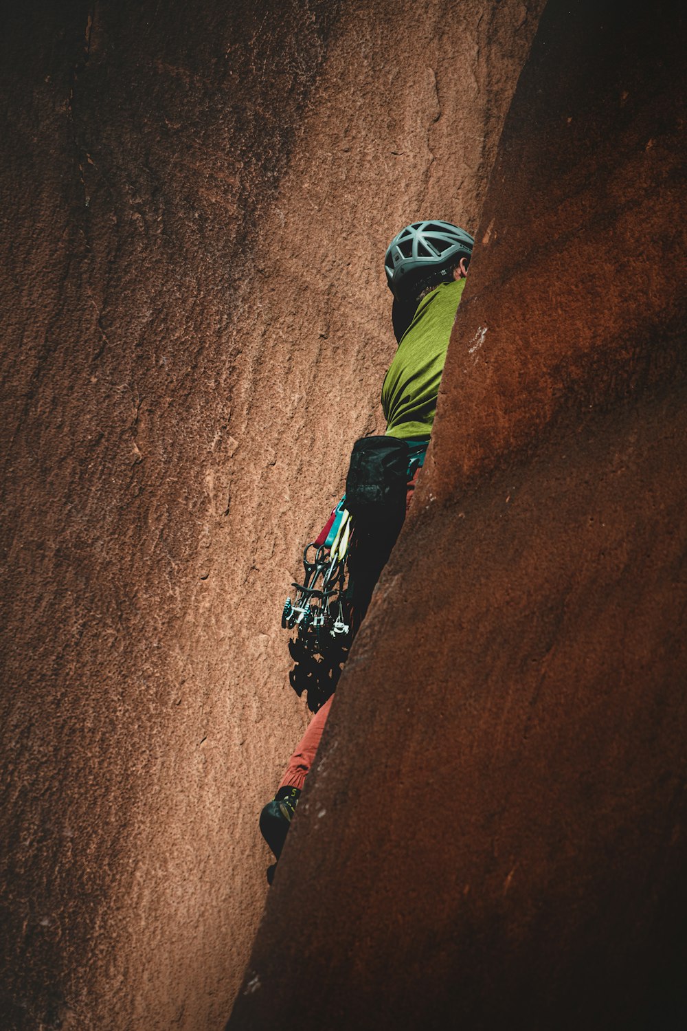 person rock climbing