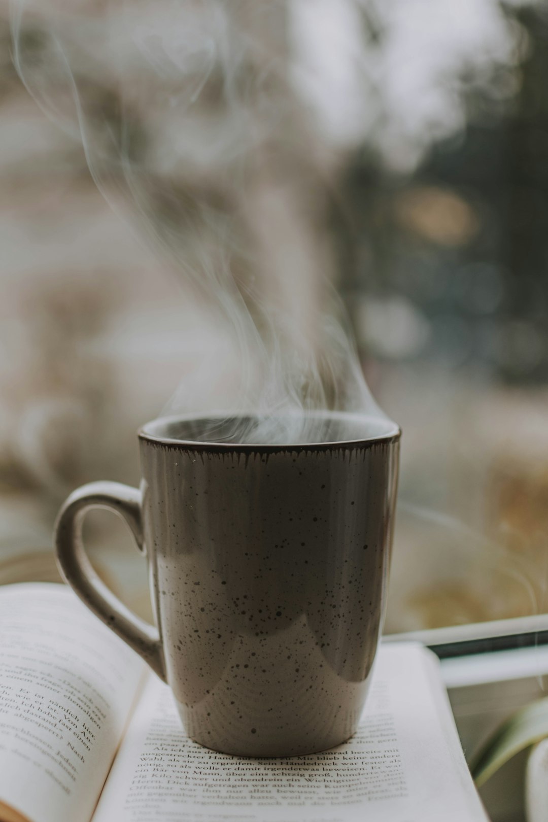 hot beverage on book