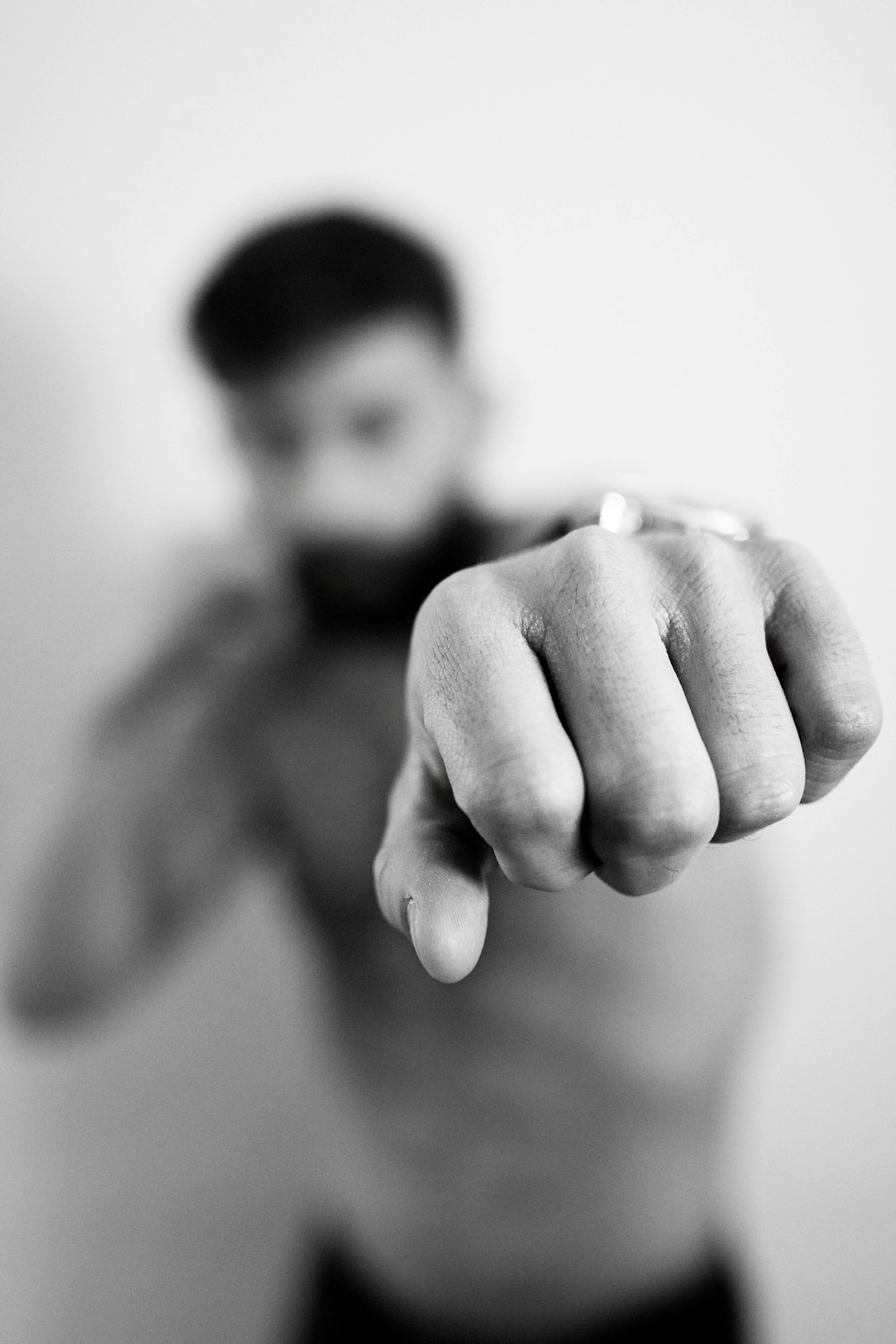 topless man raising his fist