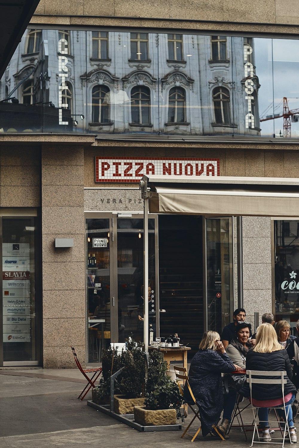 woman sitting near the building