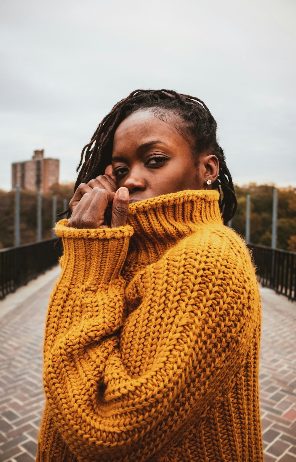 woman wearing brown knit sweater