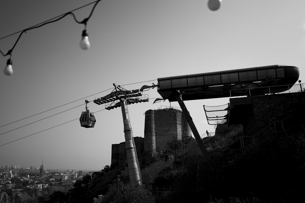 grayscale photography cable car