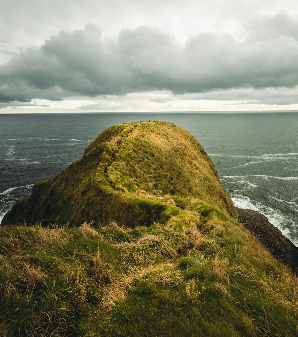 grass mountain island during day