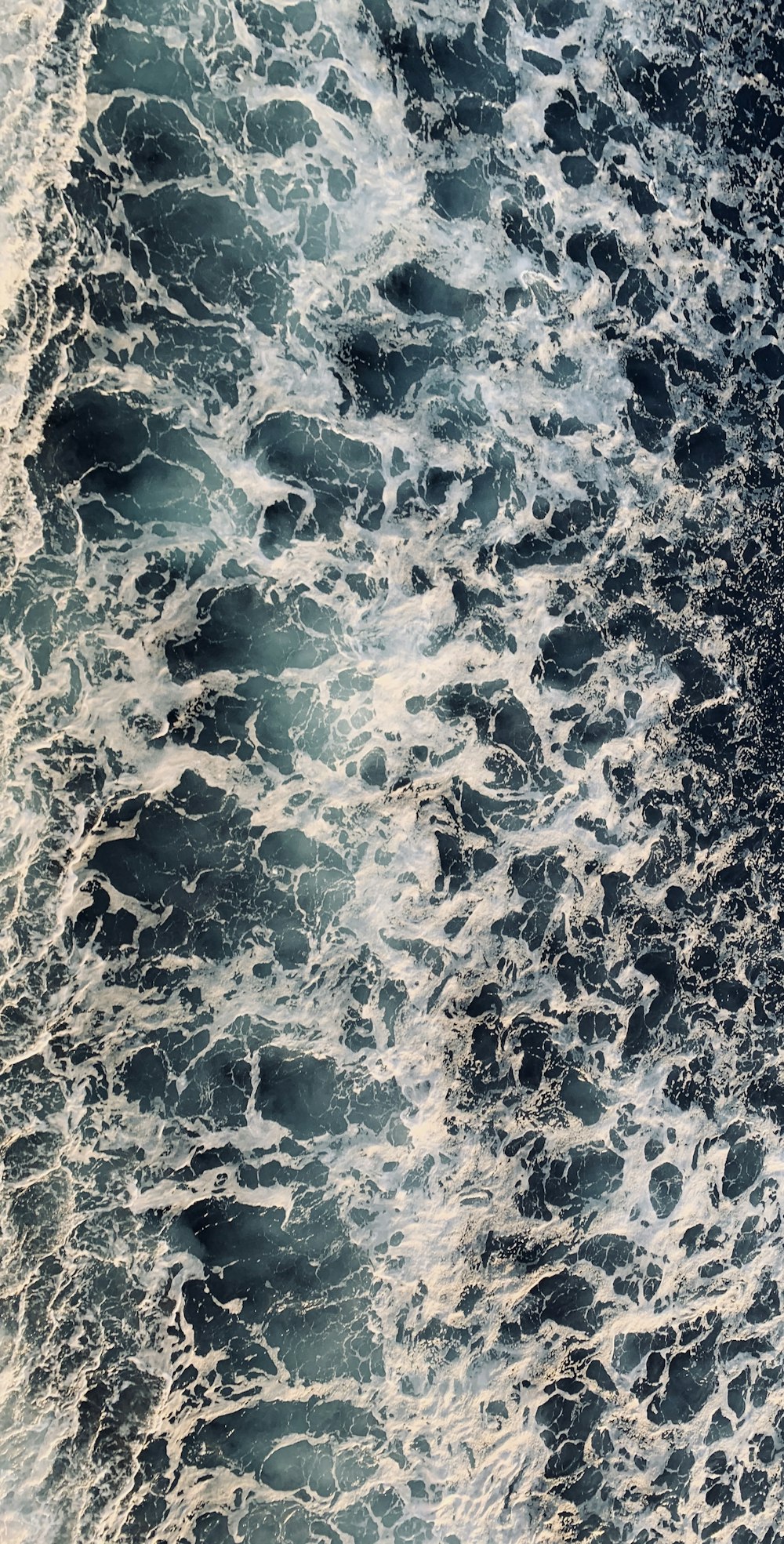 aerial view of sea waves during daytime