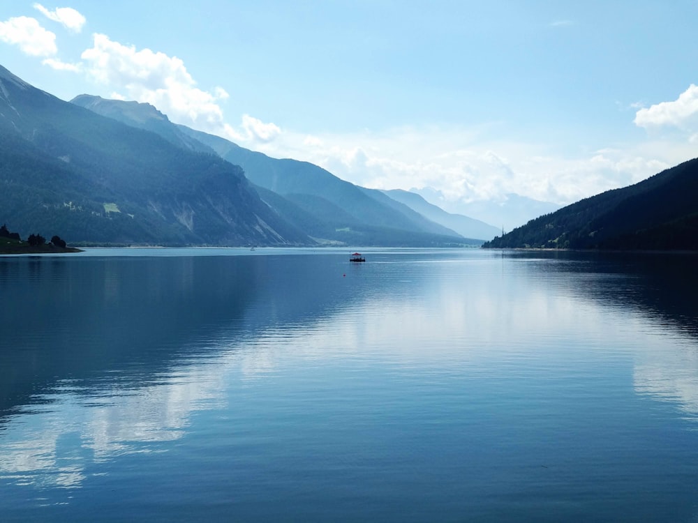 body of water and gray mountains