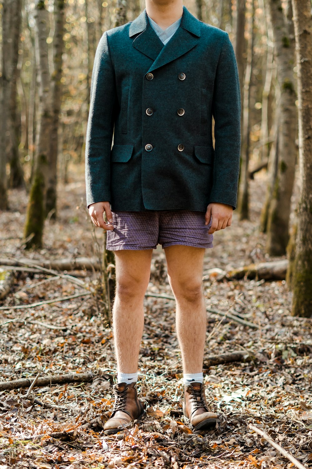 boy standing near trees