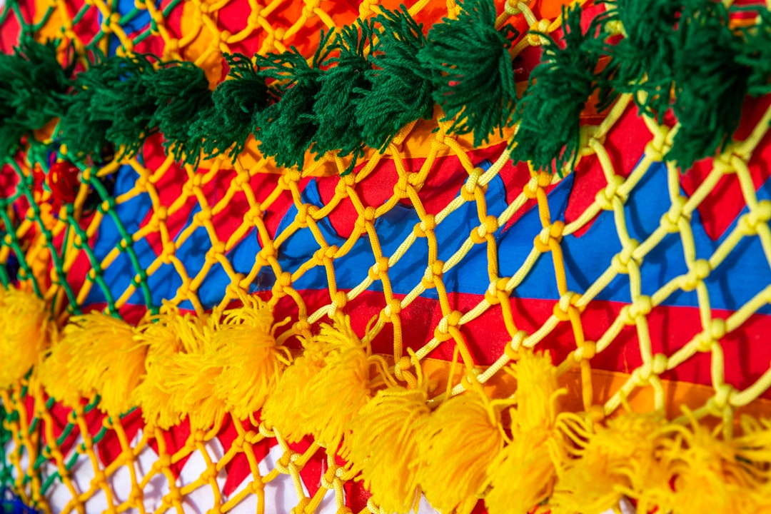 blue, yellow, red, and green knitted decor