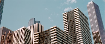 low-angle photo of buildings under blue sky