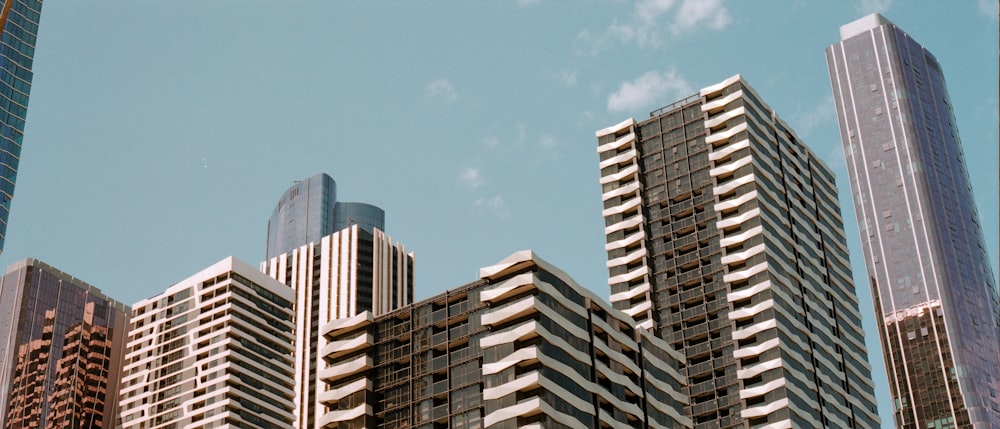 low-angle photo of buildings under blue sky