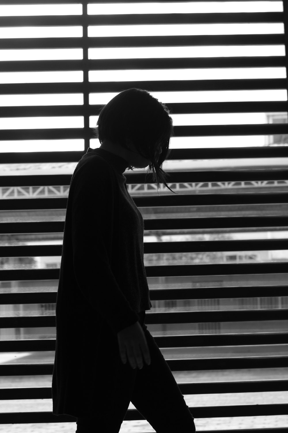 woman standing near the window