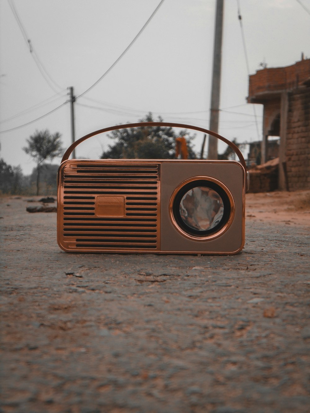 copper-colored and gray portable radio