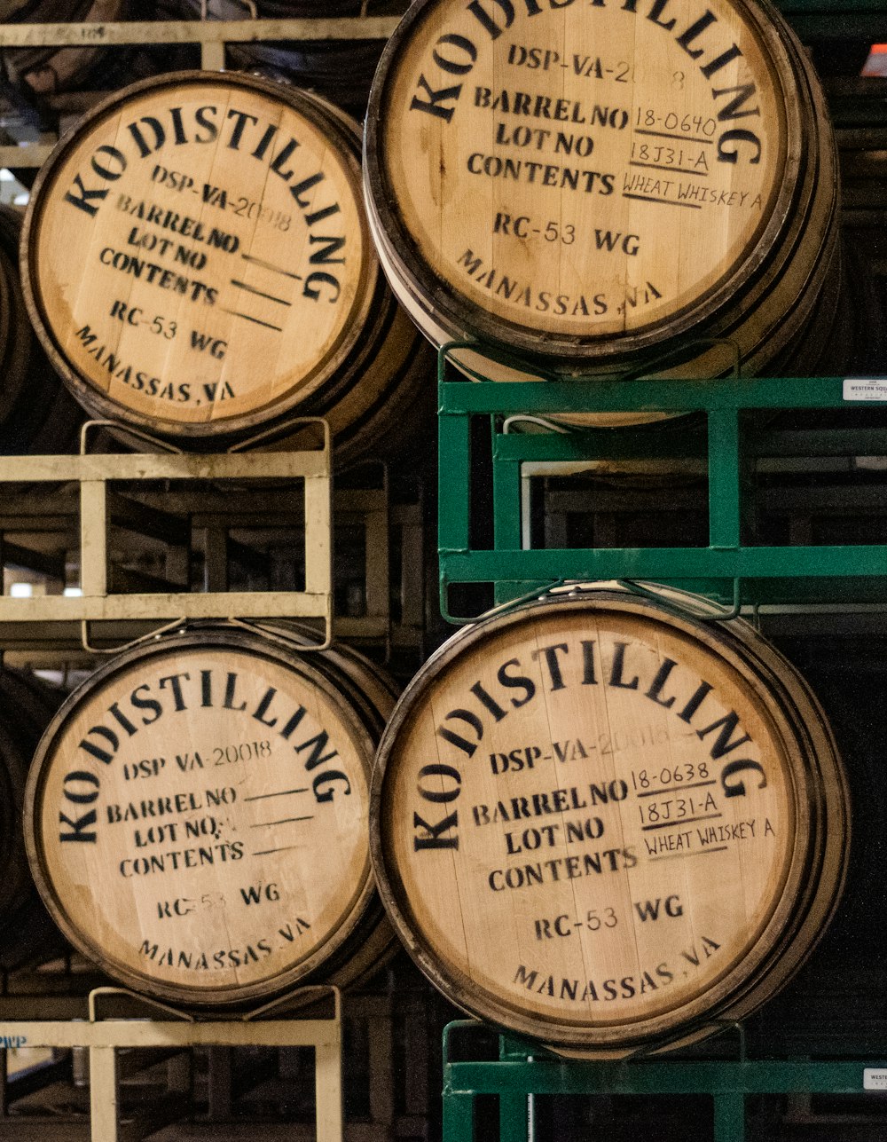 four brown Kodistilling wine barrels