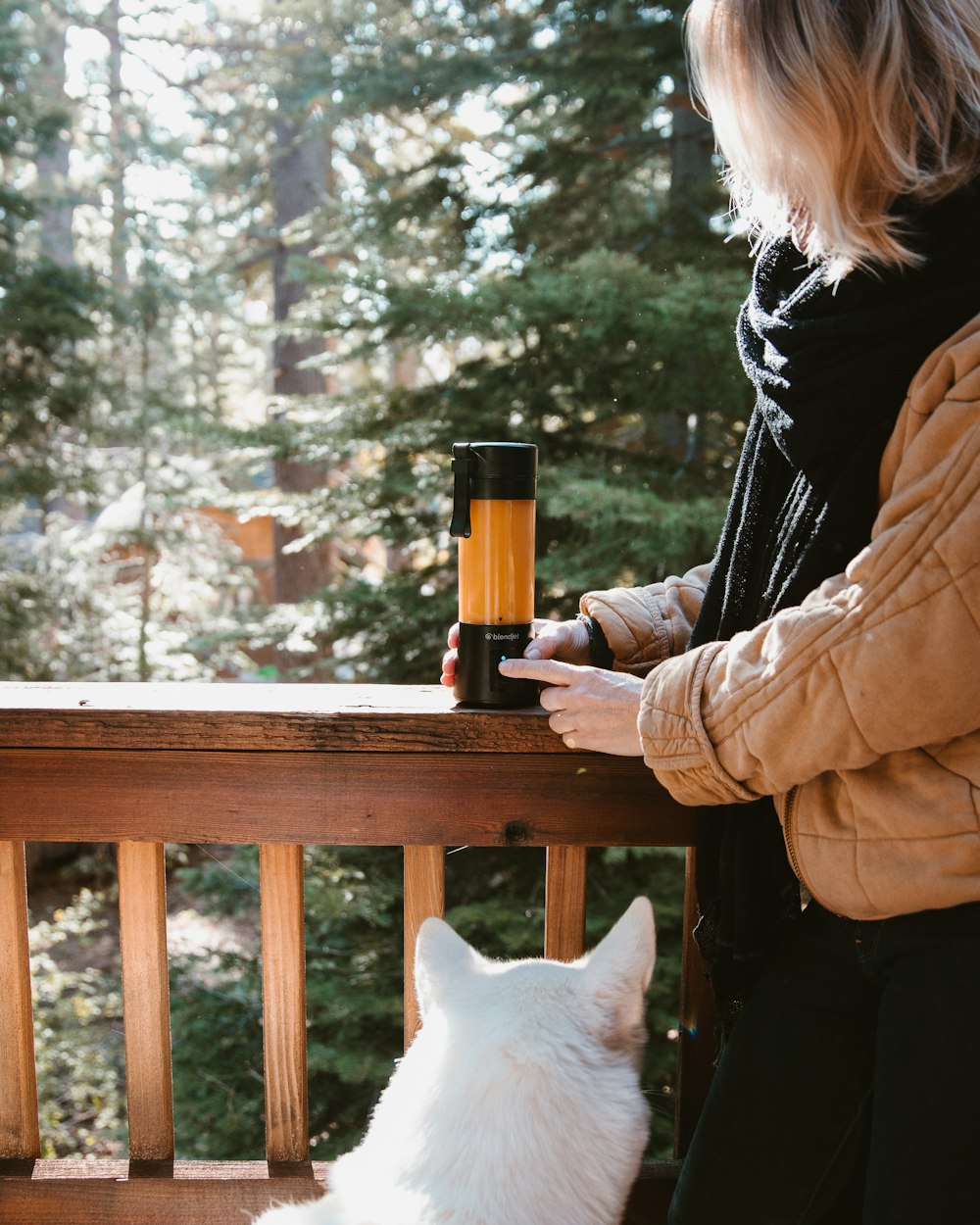 woman holding blender tumbler