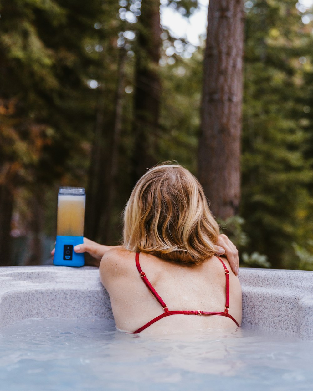 woman holding blender bottle