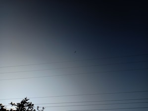 Aerial drone inspecting a power line.