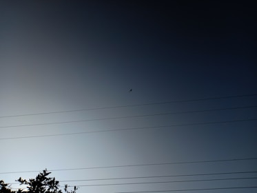Aerial drone inspecting a power line.
