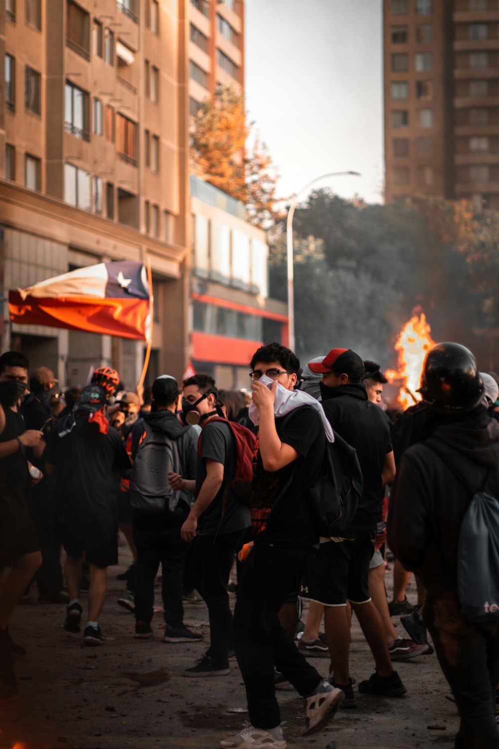 crowd holding flag during daytime