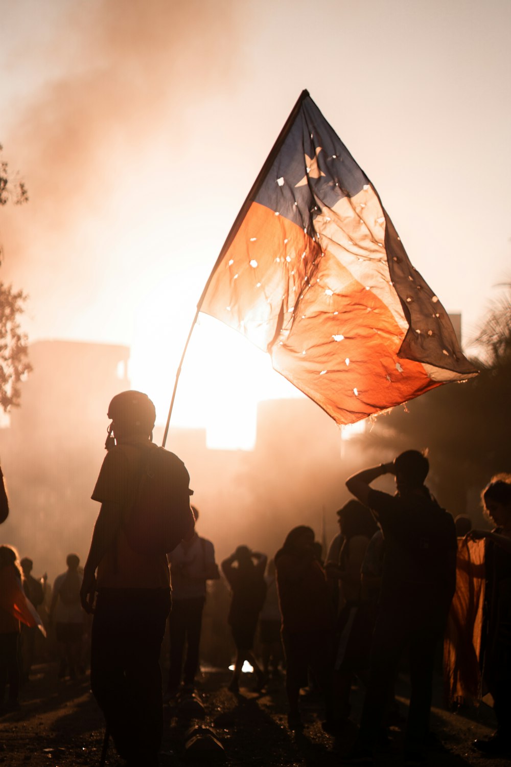 person carrying pole of flag