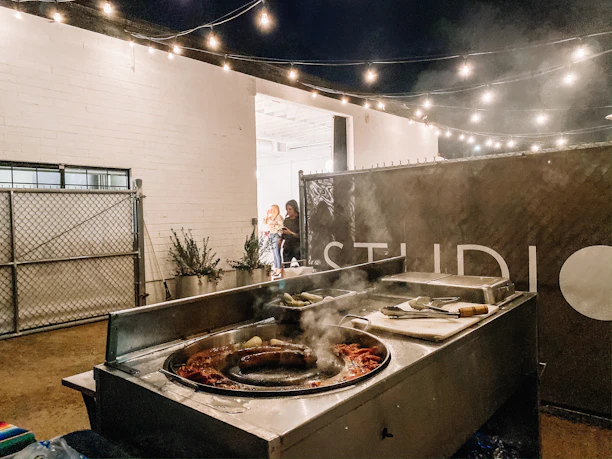 Happy customers enjoying tacos together at outdoor seating in Santiago.