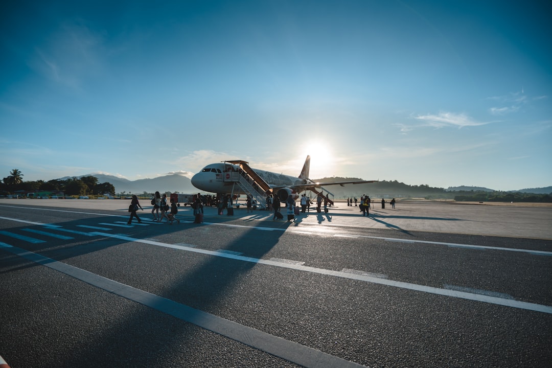 people standing beside plane during daytime