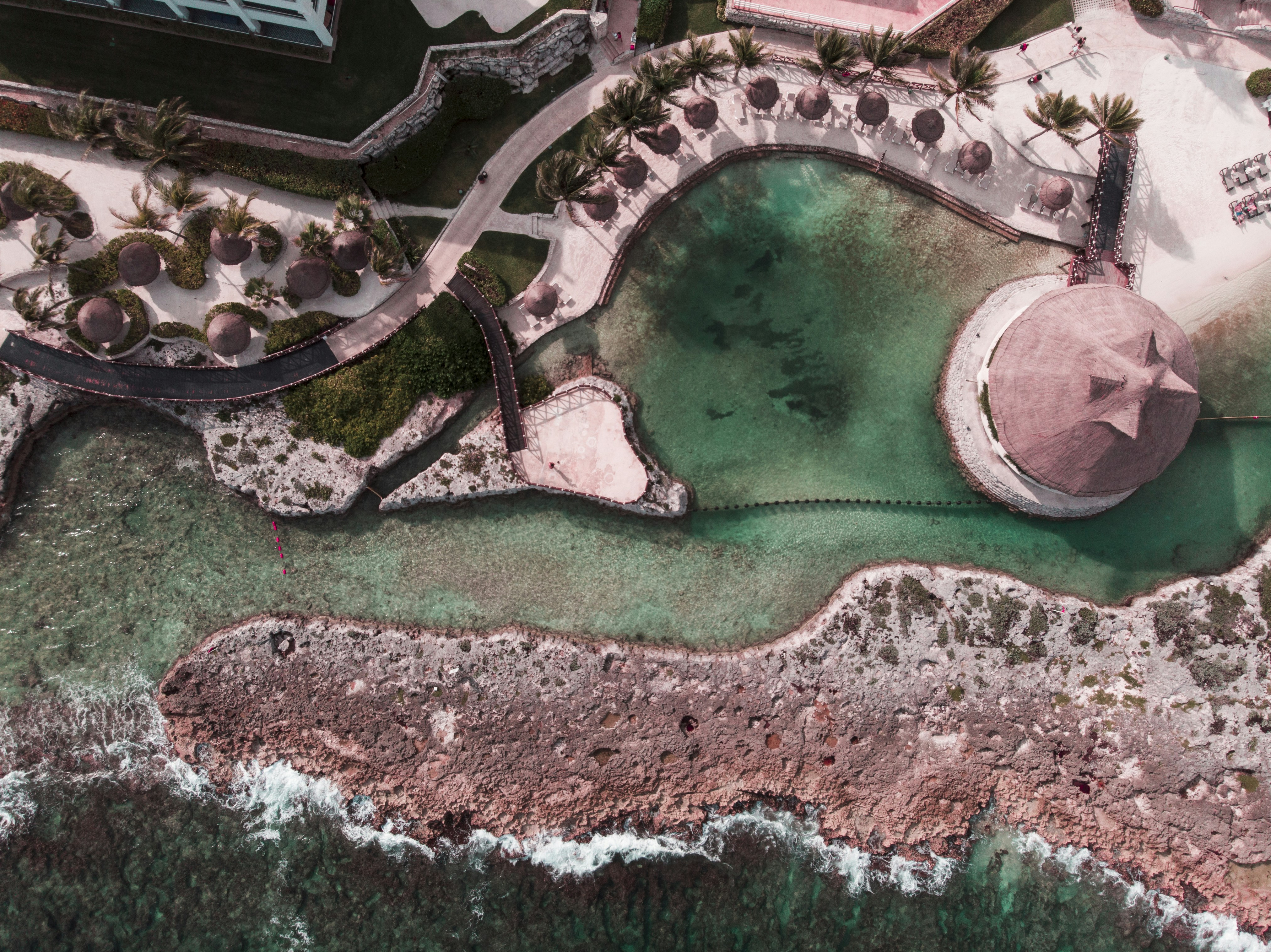 road beside body of water during daytime, drone view of the sea