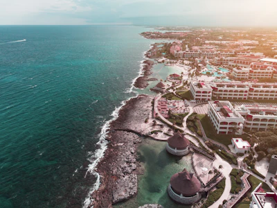aerial view of hotels and resort facing ocean