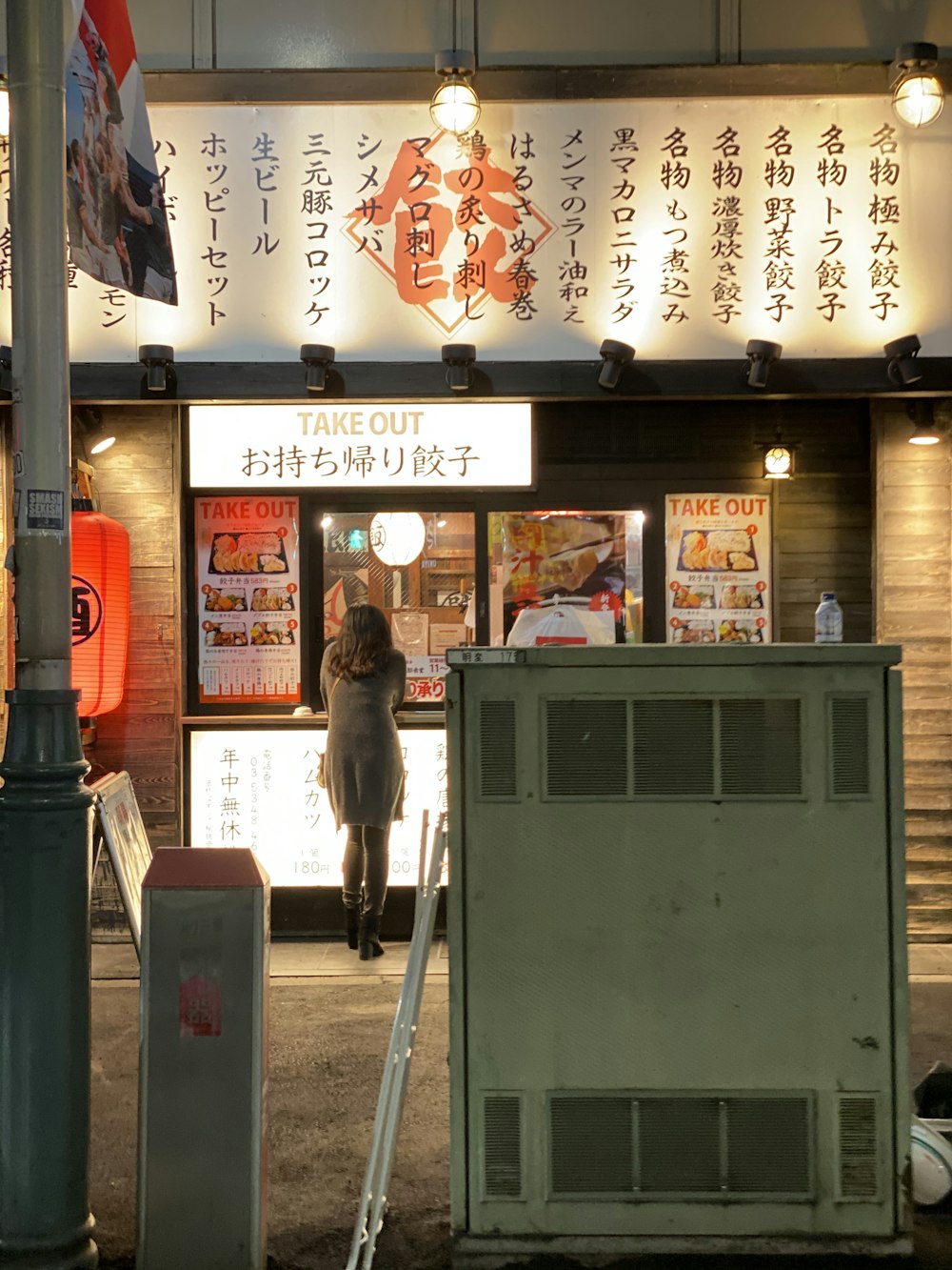 woman leaning on stall