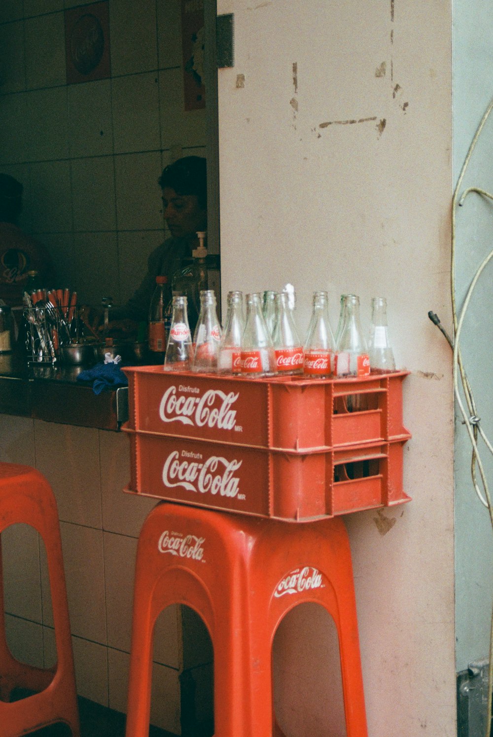 empty Coca-Cola bottles on crates